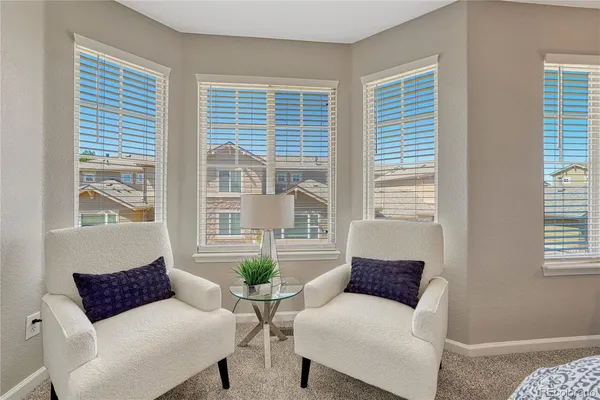 a living room with furniture and windows