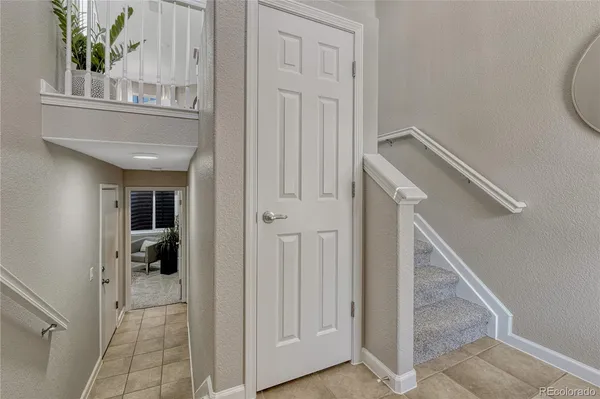 a view of entryway and hall with a front door