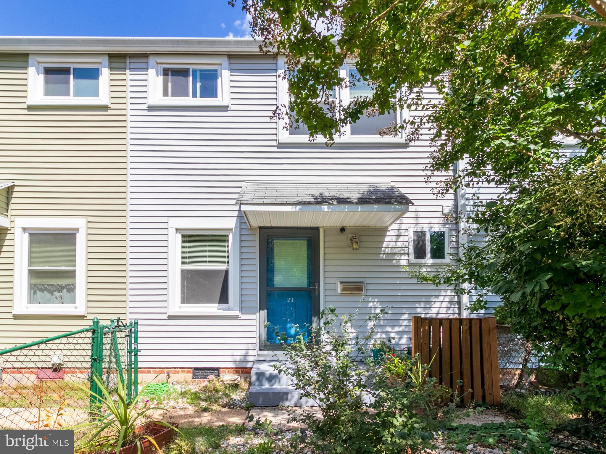 2 Laurel Hill Road Greenbelt, MD 20770 - Photo 1 of 19 a view of a house with a small window and potted plants