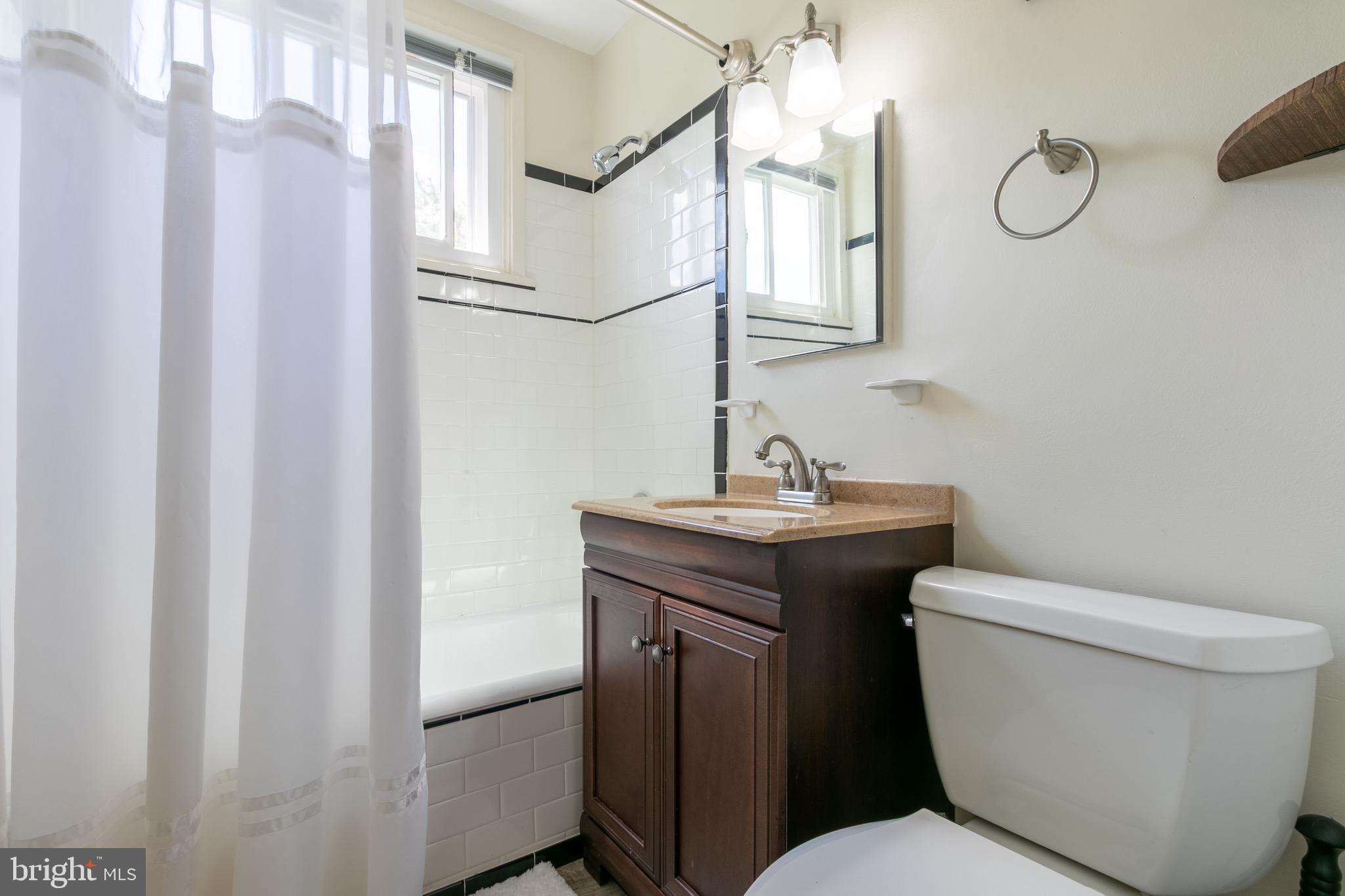 2 Laurel Hill Road Greenbelt, MD 20770 - Photo 11 of 19 a bathroom with a toilet a sink and a mirror