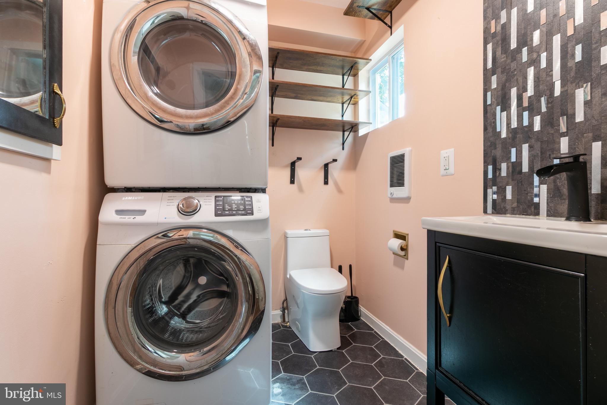 2 Laurel Hill Road Greenbelt, MD 20770 - Photo 15 of 19 a view of a bedroom with washer and dryer