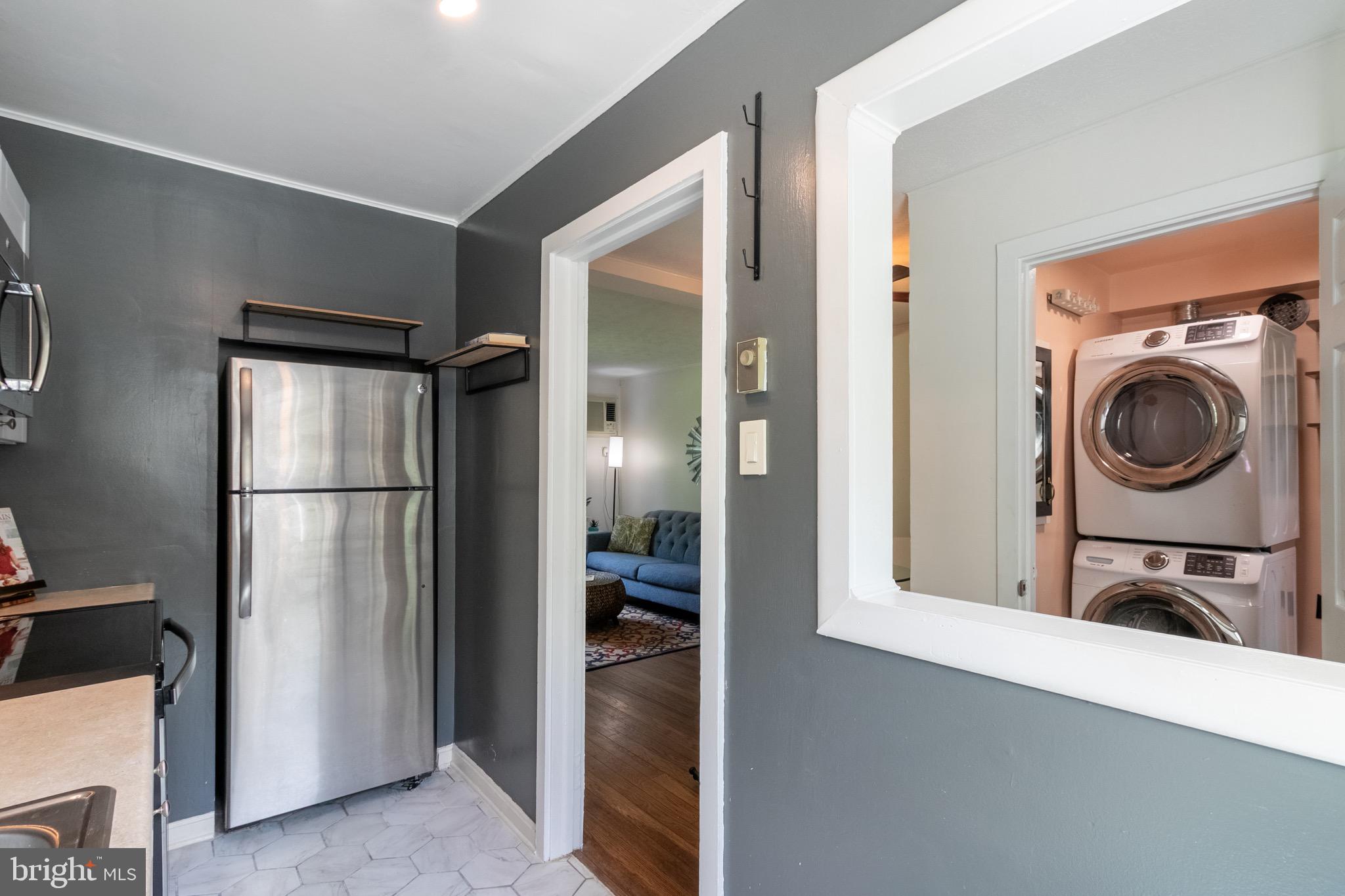 2 Laurel Hill Road Greenbelt, MD 20770 - Photo 6 of 19 a kitchen with a refrigerator and washer