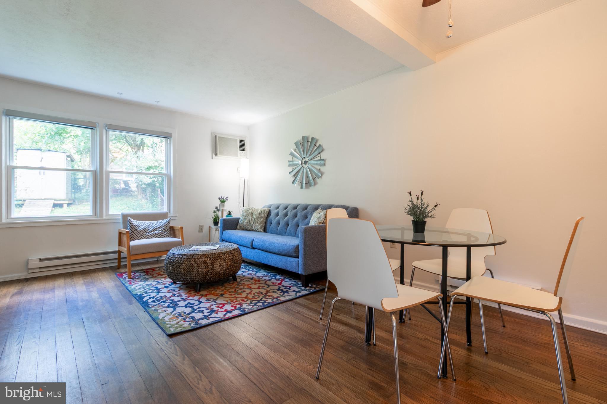 2 Laurel Hill Road Greenbelt, MD 20770 - Photo 7 of 19 a living room with furniture a rug a window and a table