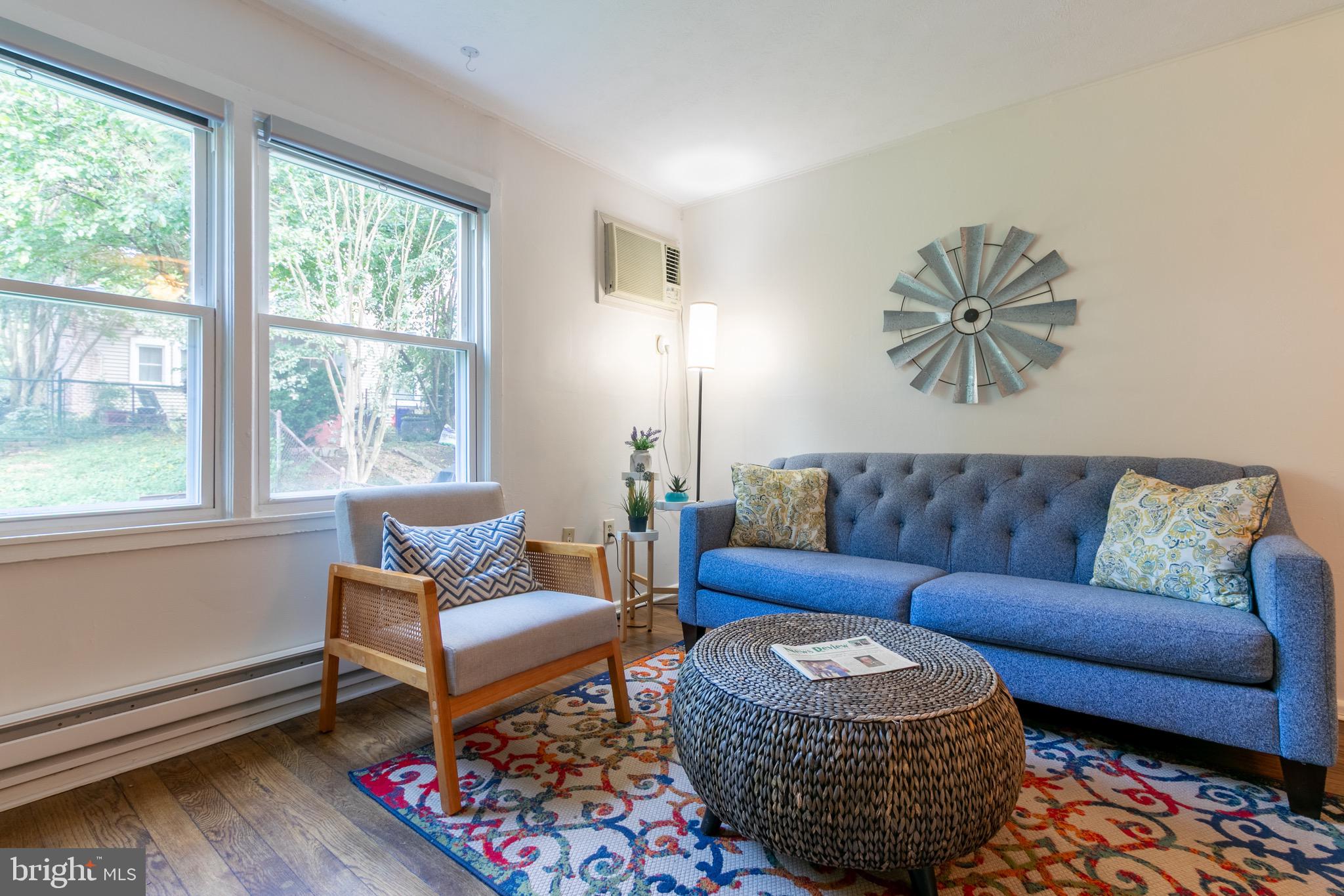 2 Laurel Hill Road Greenbelt, MD 20770 - Photo 9 of 19 a living room with furniture a rug and a window