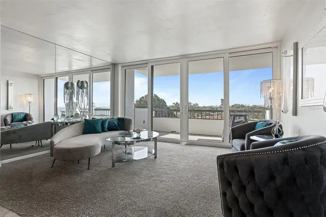 a kitchen with stainless steel appliances granite countertop a sink and a stove