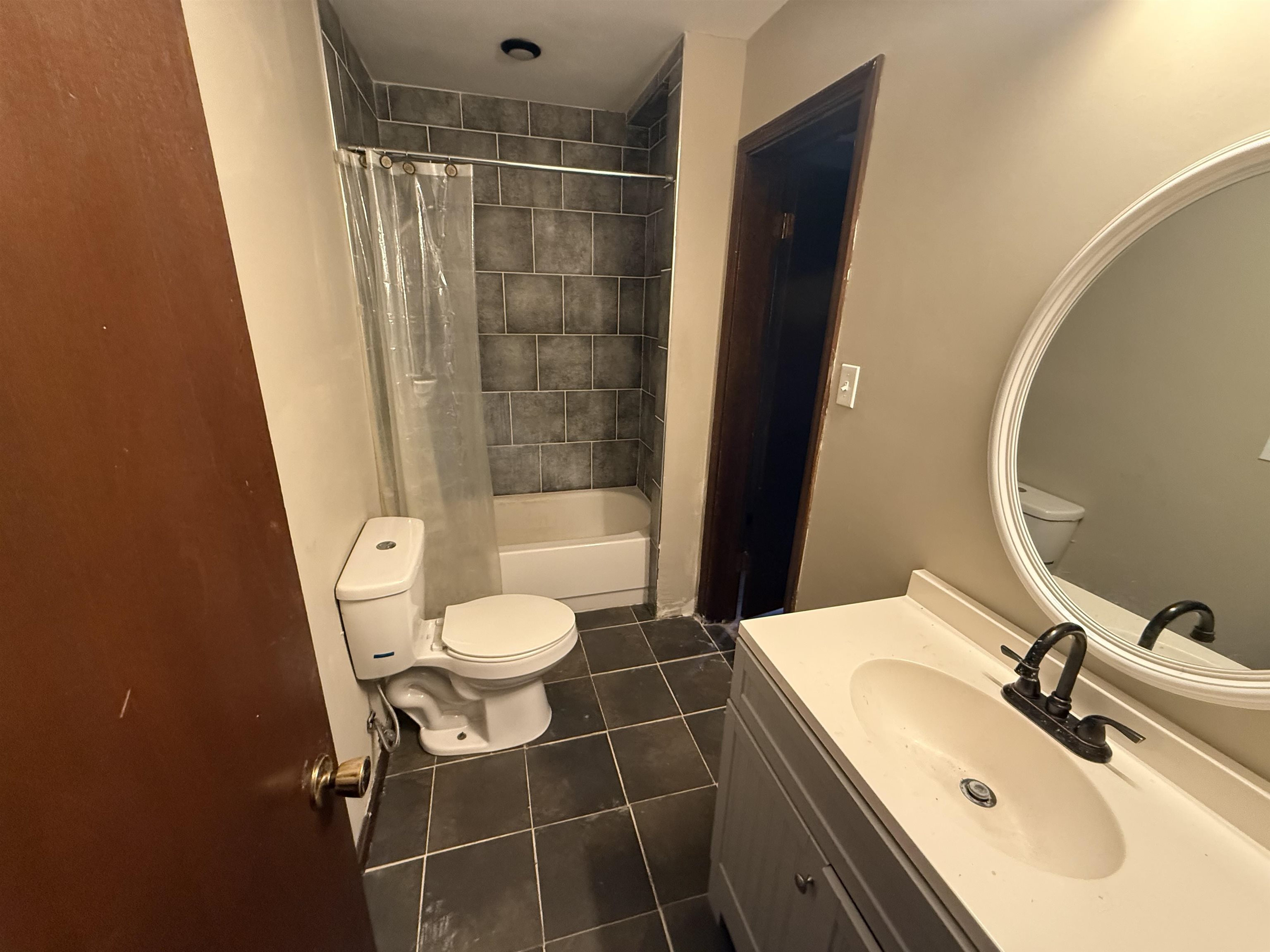 10320 Macon Road Cordova, TN 38016 - Photo 12 of 17 a bathroom with a sink toilet and shower