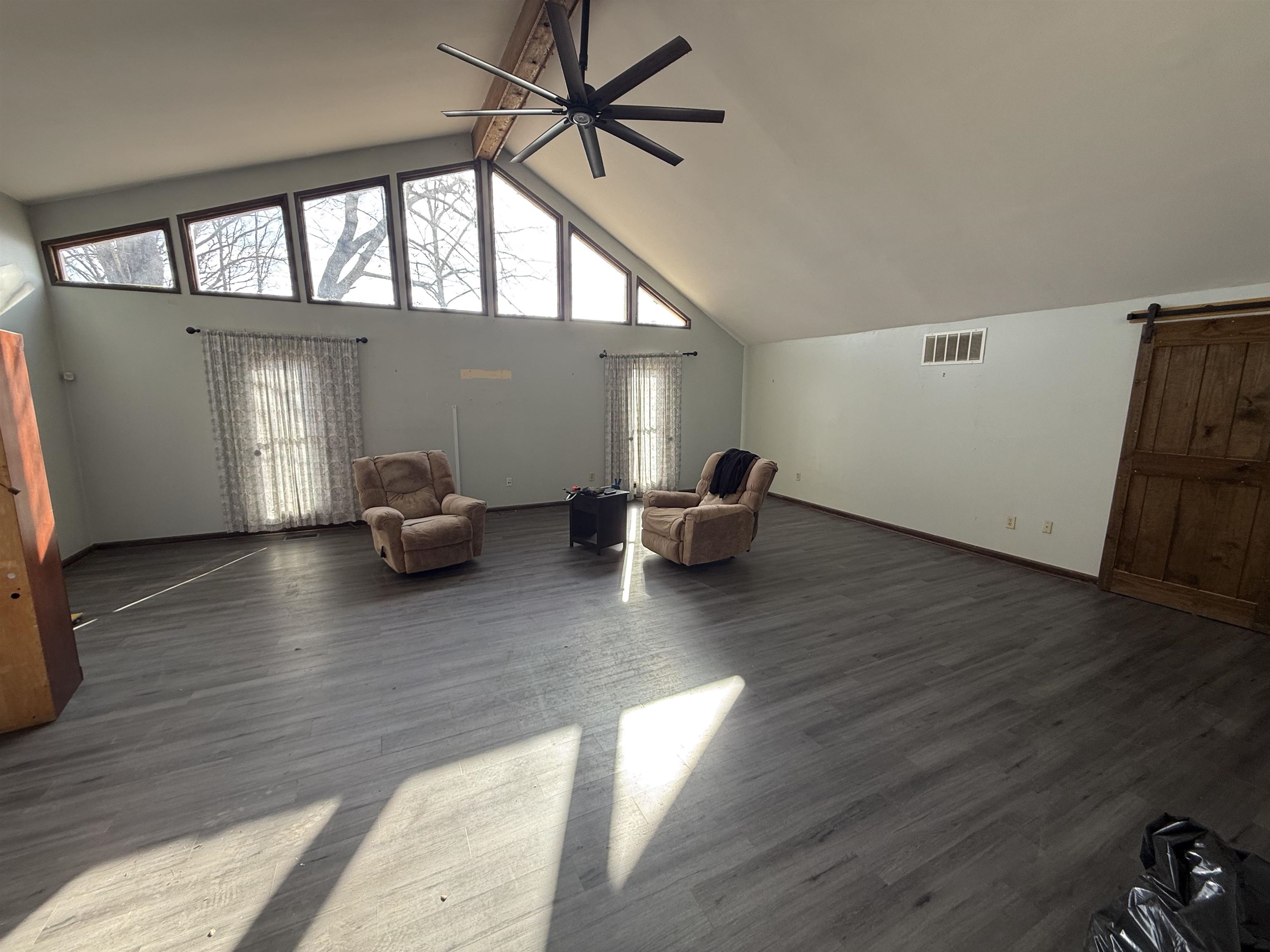 10320 Macon Road Cordova, TN 38016 - Photo 5 of 17 a view of empty room with wooden floor and fan