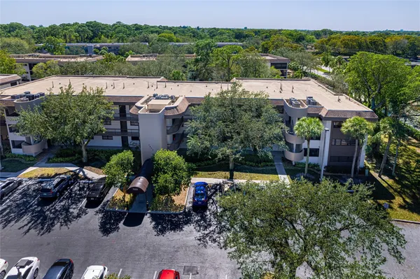 an aerial view of a house with yard swimming pool and outdoor seating