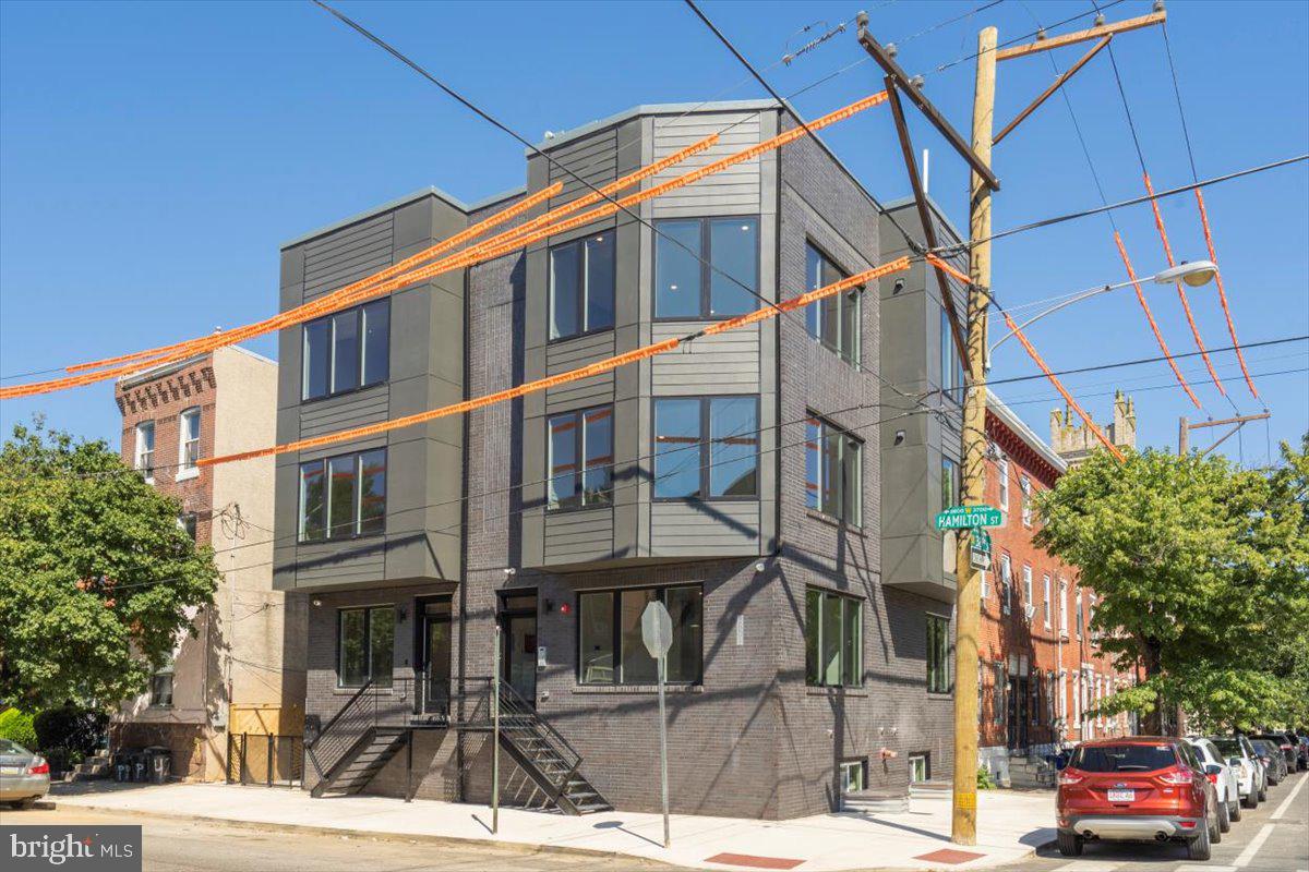 a view of a building with a street