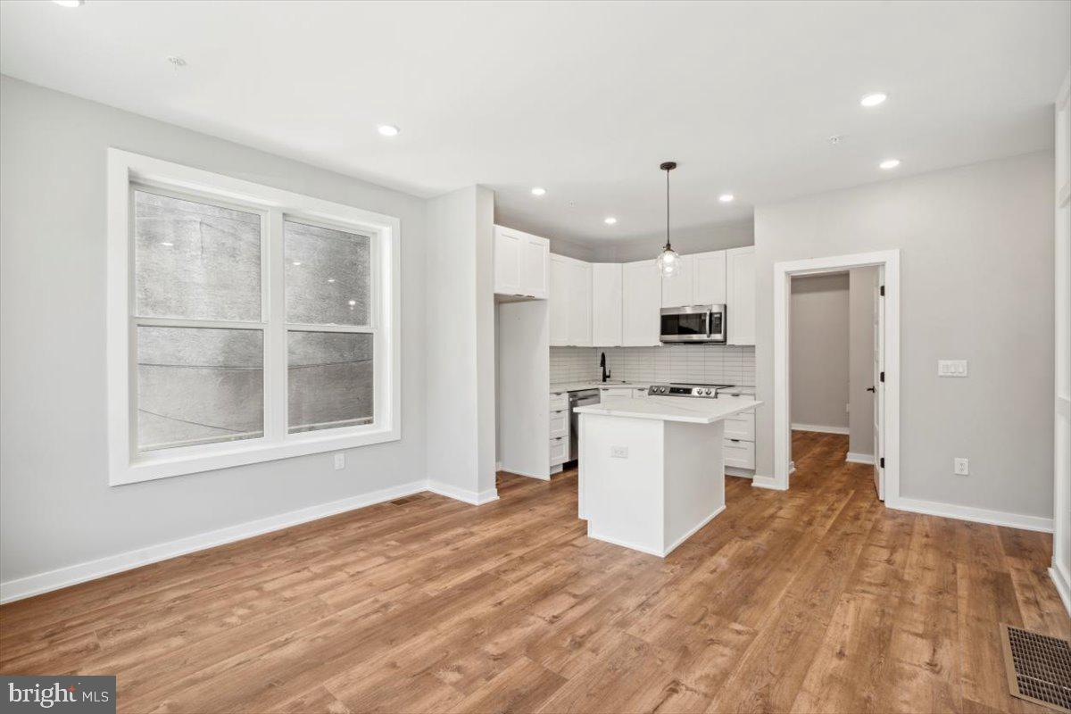 3801 Hamilton Street, Unit B Philadelphia, PA 19104 - Photo 14 of 46 a kitchen with white cabinets and window