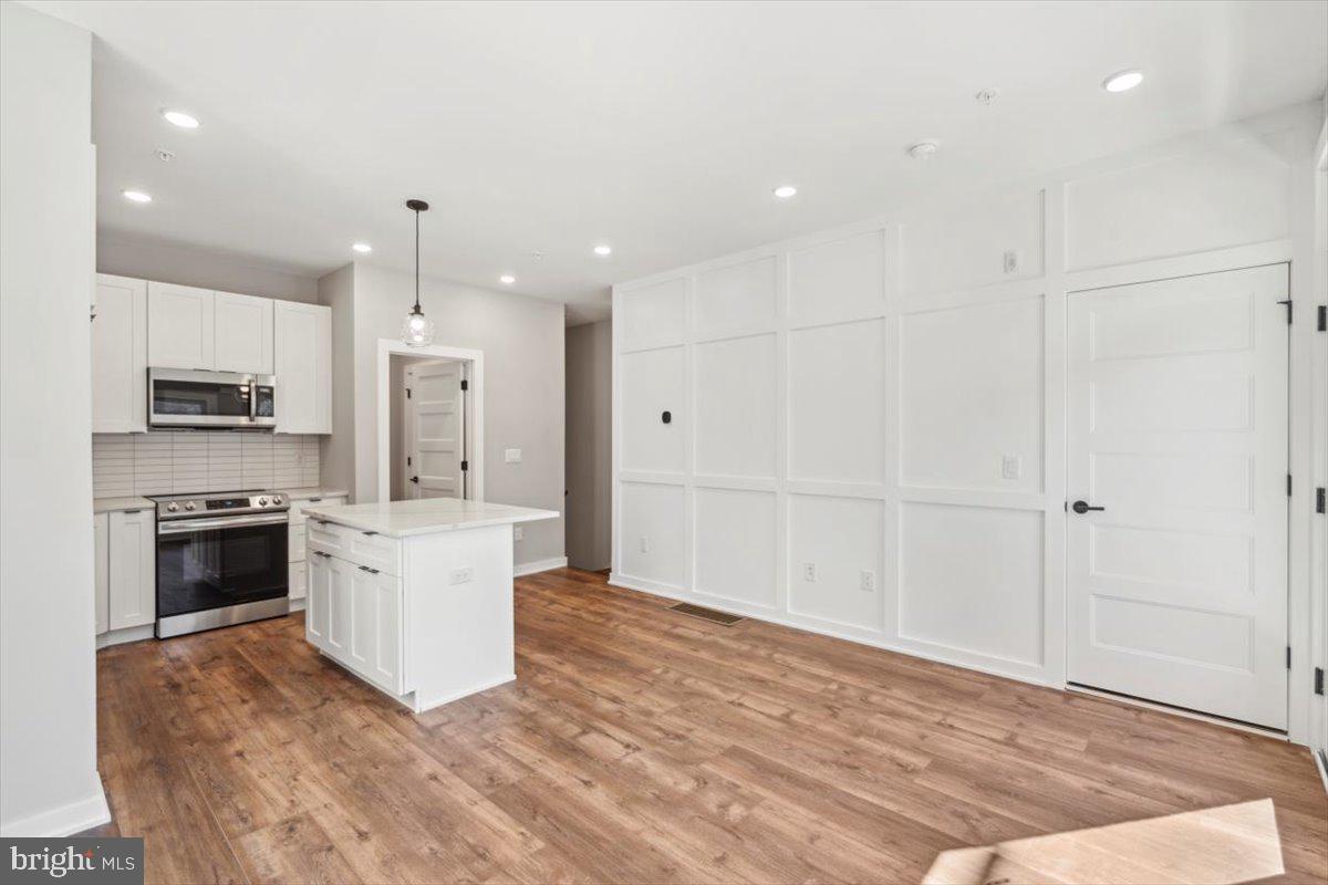 3801 Hamilton Street, Unit B Philadelphia, PA 19104 - Photo 15 of 46 a large white kitchen with a stove a sink and a refrigerator