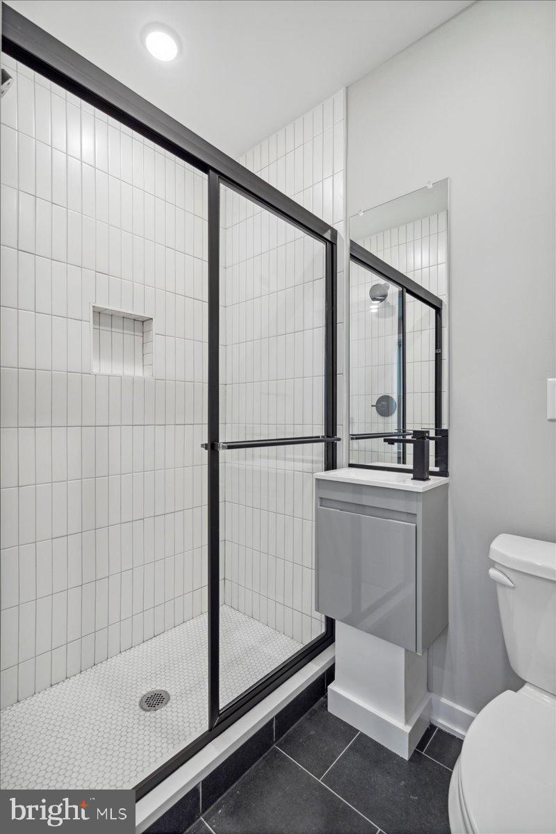 3801 Hamilton Street, Unit B Philadelphia, PA 19104 - Photo 20 of 46 a bathroom with a toilet and a shower