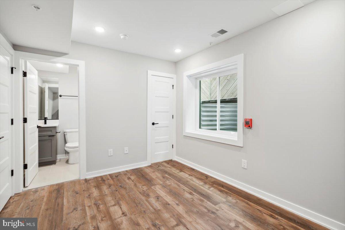 3801 Hamilton Street, Unit B Philadelphia, PA 19104 - Photo 21 of 46 a view of a bedroom with a hardwood and front door