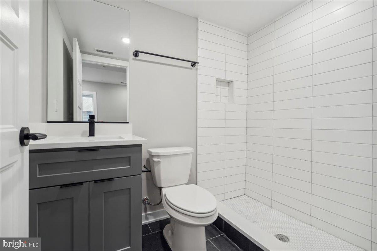 3801 Hamilton Street, Unit B Philadelphia, PA 19104 - Photo 24 of 46 a bathroom with a sink a toilet and shower