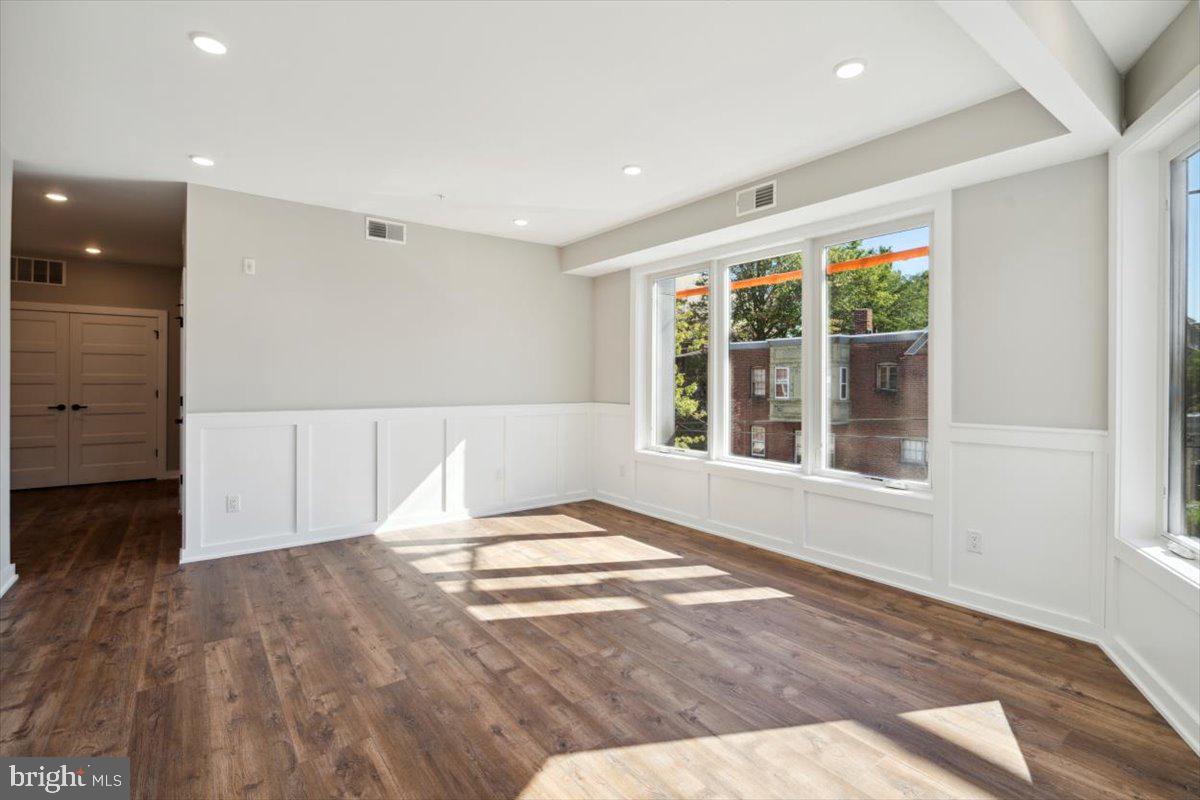 3801 Hamilton Street, Unit B Philadelphia, PA 19104 - Photo 25 of 46 a view of an empty room with wooden floor and a window