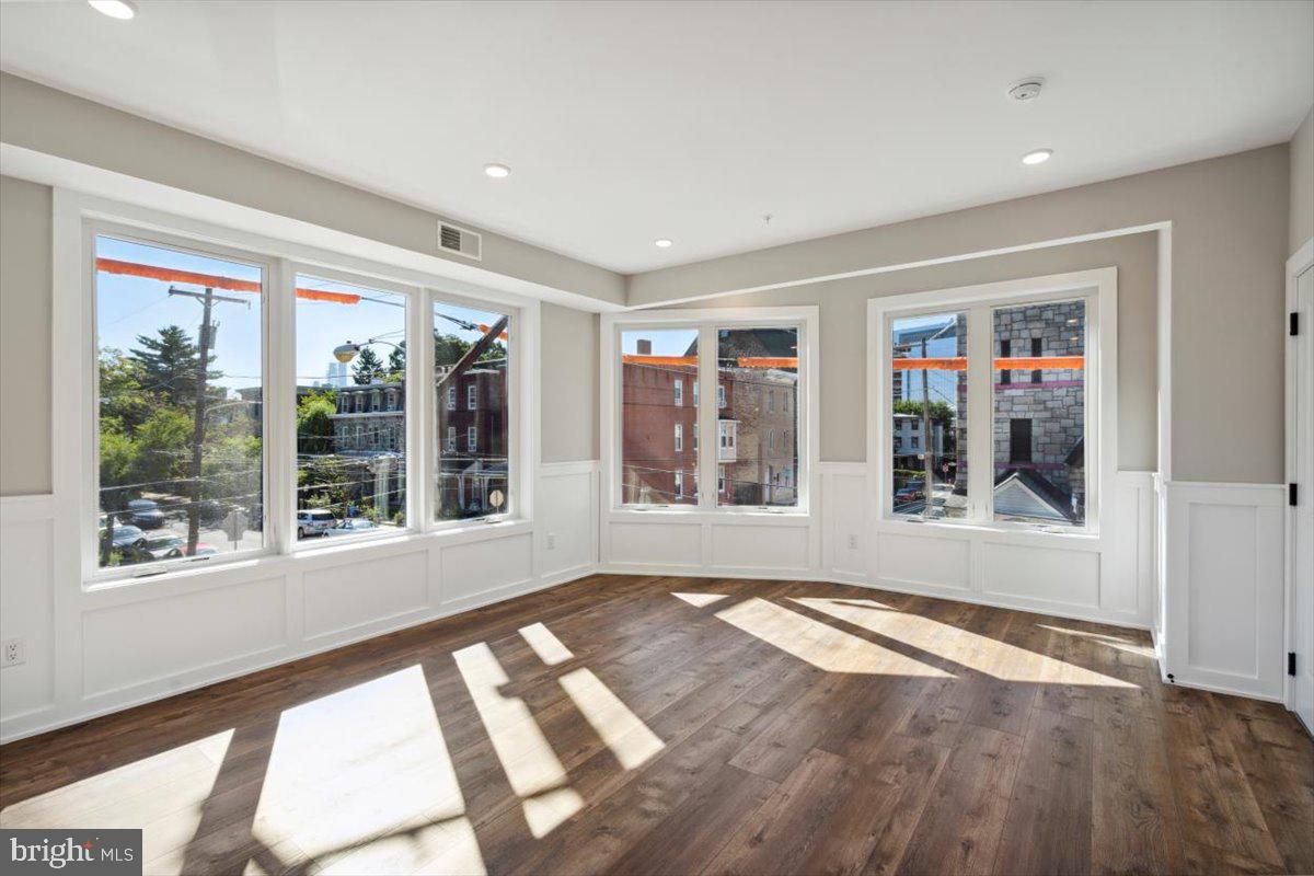 3801 Hamilton Street, Unit B Philadelphia, PA 19104 - Photo 26 of 46 a view of an empty room with wooden floor and a window