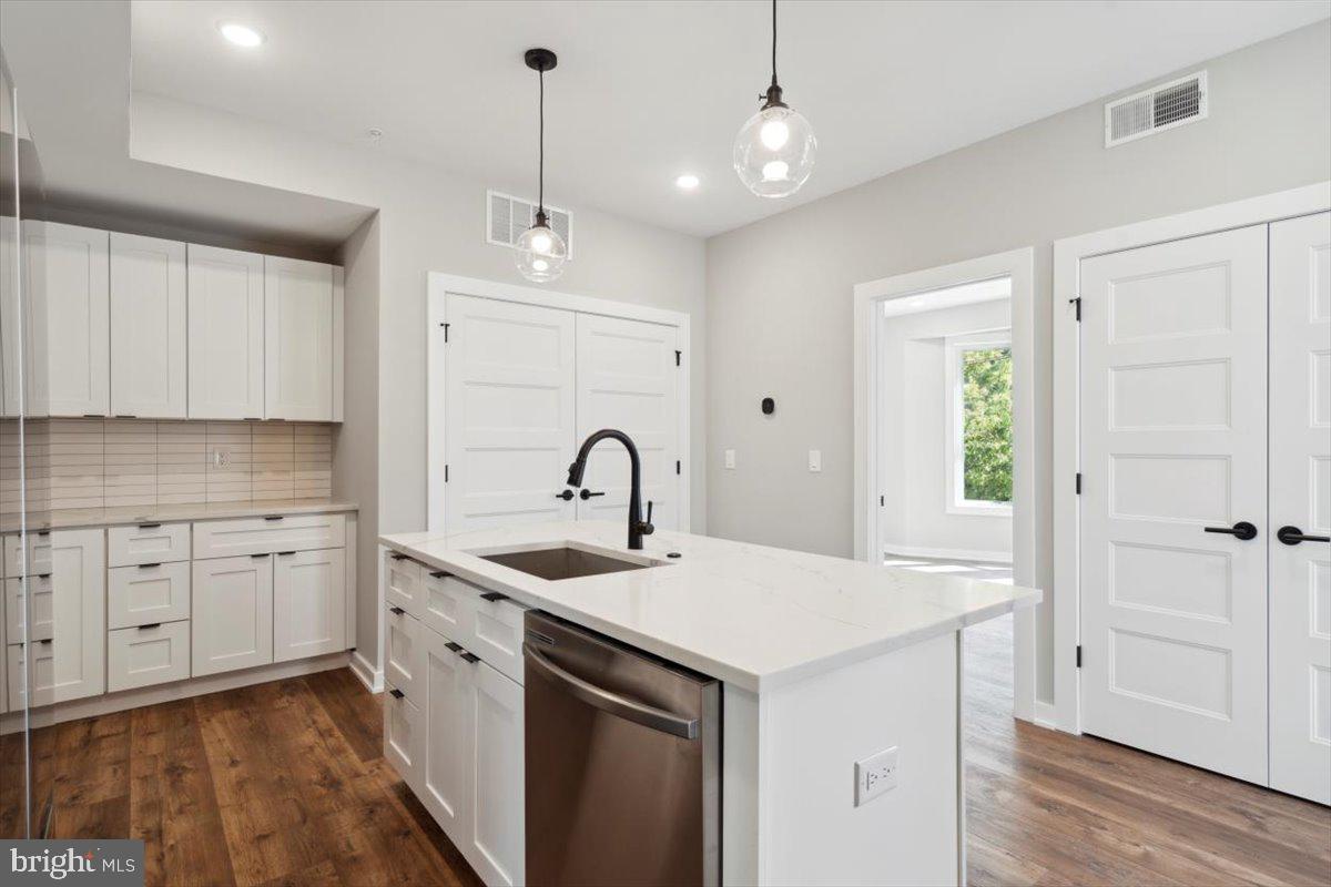 3801 Hamilton Street, Unit B Philadelphia, PA 19104 - Photo 28 of 46 a kitchen with a sink a stove a refrigerator and cabinets
