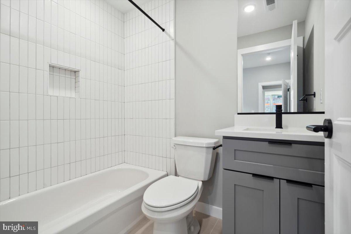 3801 Hamilton Street, Unit B Philadelphia, PA 19104 - Photo 34 of 46 a bathroom with a sink a toilet and shower