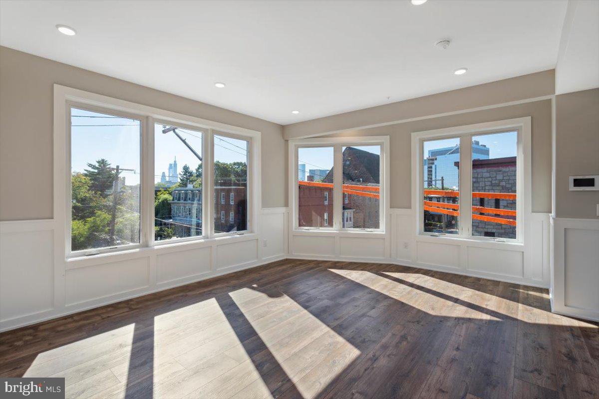 3801 Hamilton Street, Unit B Philadelphia, PA 19104 - Photo 36 of 46 an empty room with wooden floor and windows