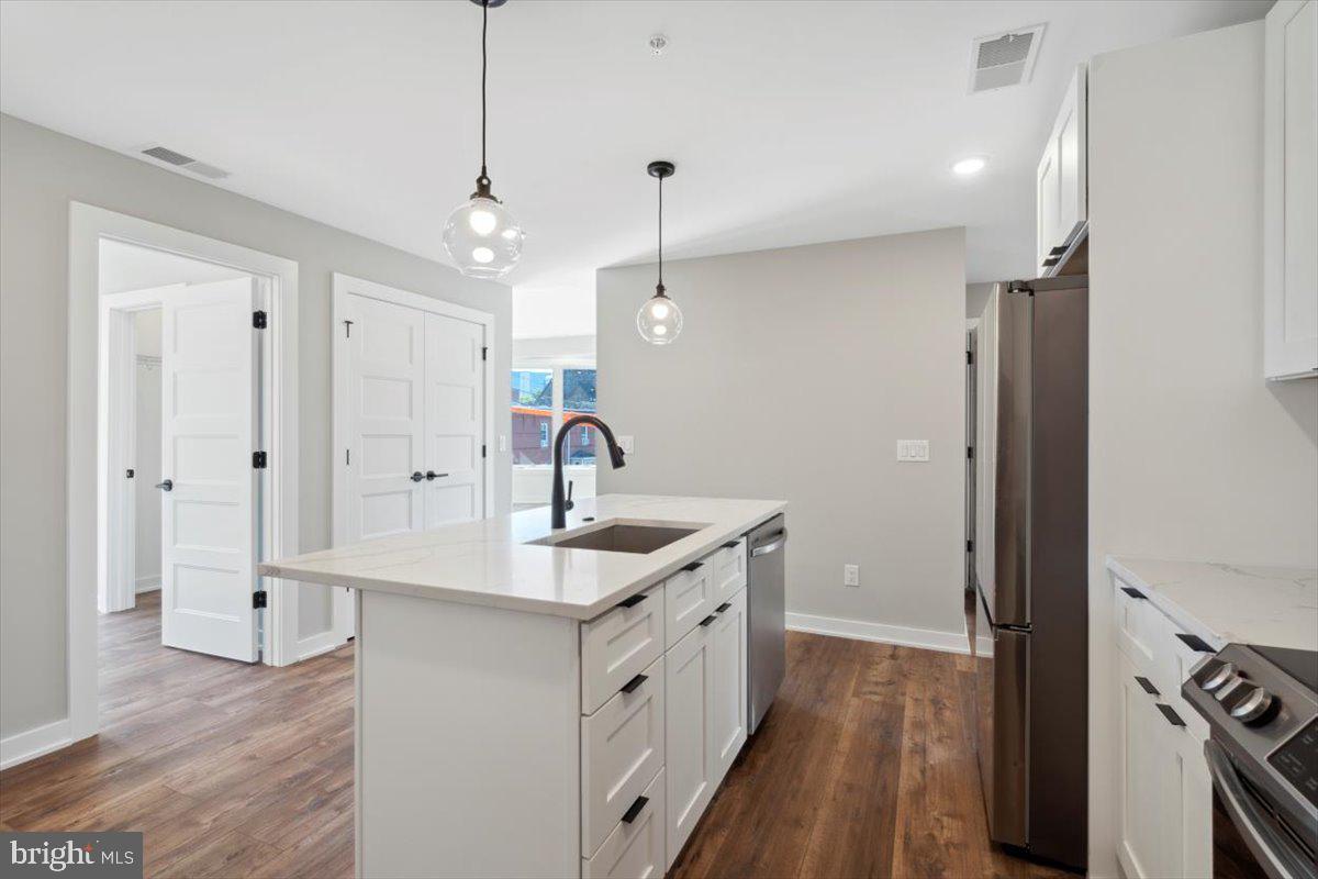 3801 Hamilton Street, Unit B Philadelphia, PA 19104 - Photo 39 of 46 a kitchen with a sink stove and refrigerator