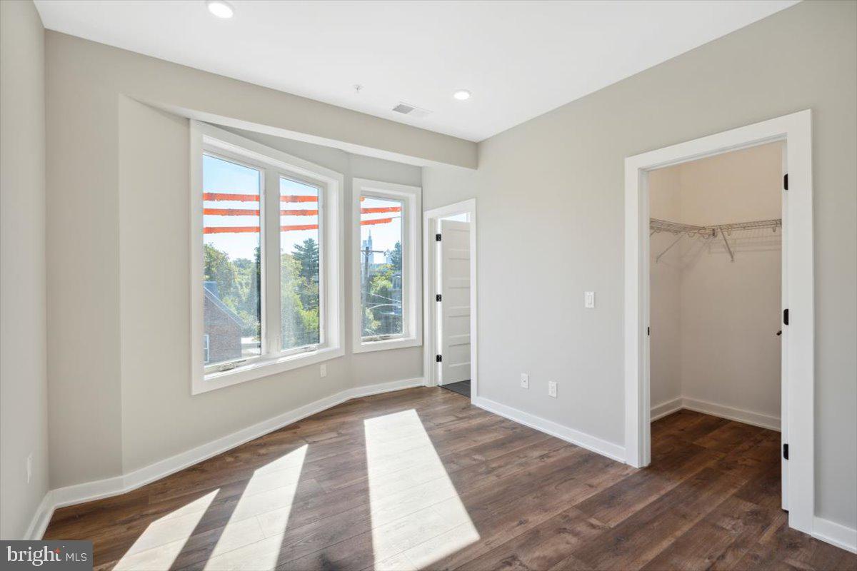 3801 Hamilton Street, Unit B Philadelphia, PA 19104 - Photo 41 of 46 a view of an empty room with wooden floor and a window