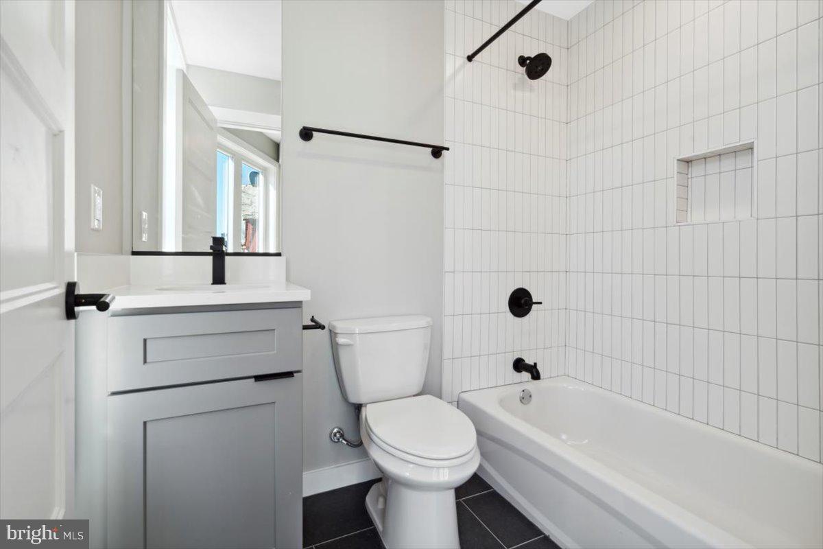 3801 Hamilton Street, Unit B Philadelphia, PA 19104 - Photo 42 of 46 a bathroom with a sink a toilet and a bathtub
