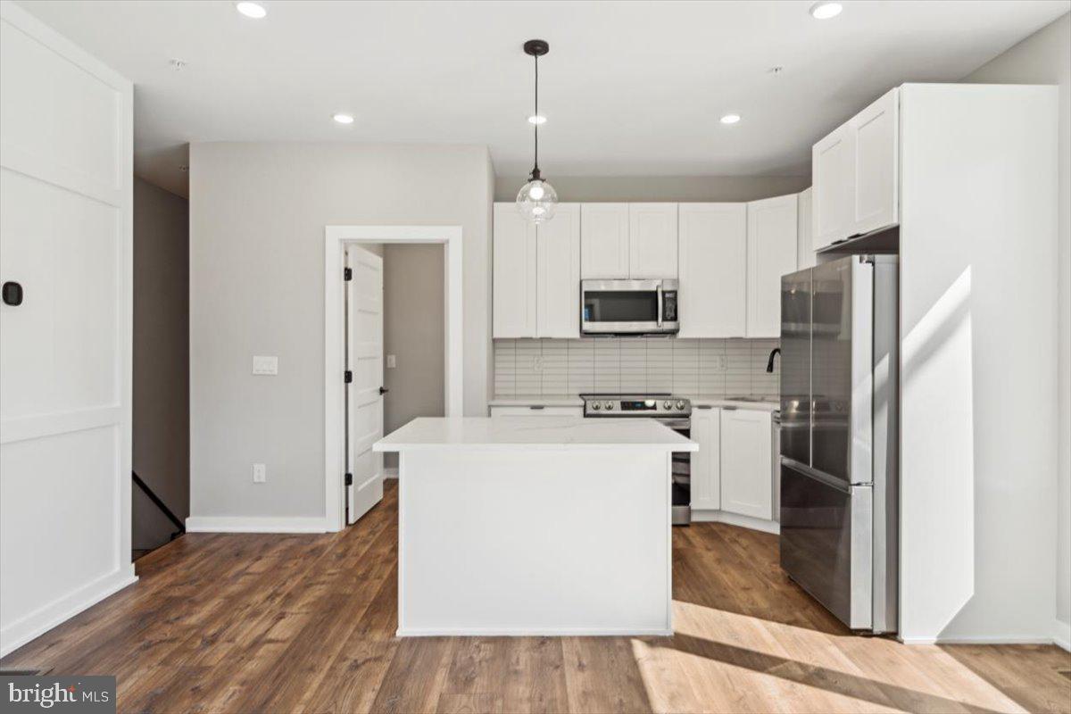 3801 Hamilton Street, Unit B Philadelphia, PA 19104 - Photo 5 of 46 a kitchen with stainless steel appliances a refrigerator sink and microwave