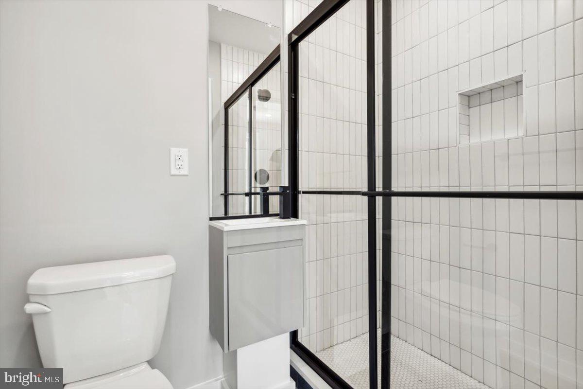 3801 Hamilton Street, Unit B Philadelphia, PA 19104 - Photo 8 of 46 a bathroom with a toilet and a shower