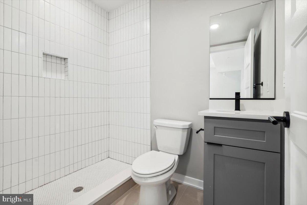 3801 Hamilton Street, Unit B Philadelphia, PA 19104 - Photo 10 of 46 a bathroom with a sink a toilet and shower