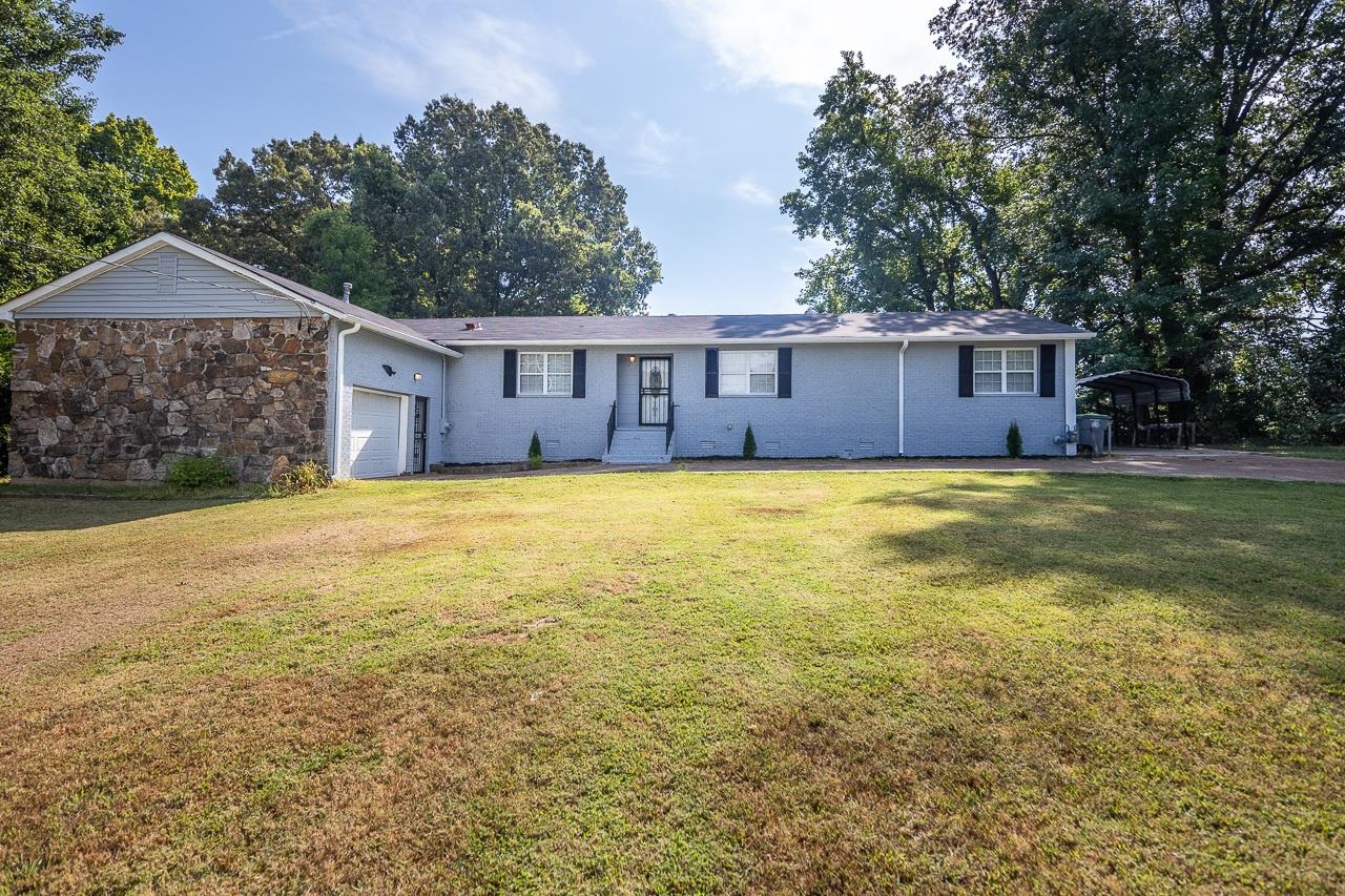 3864 Hobson Road Memphis, TN 38128 - Photo 1 of 19 Single story home featuring a garage and a front lawn