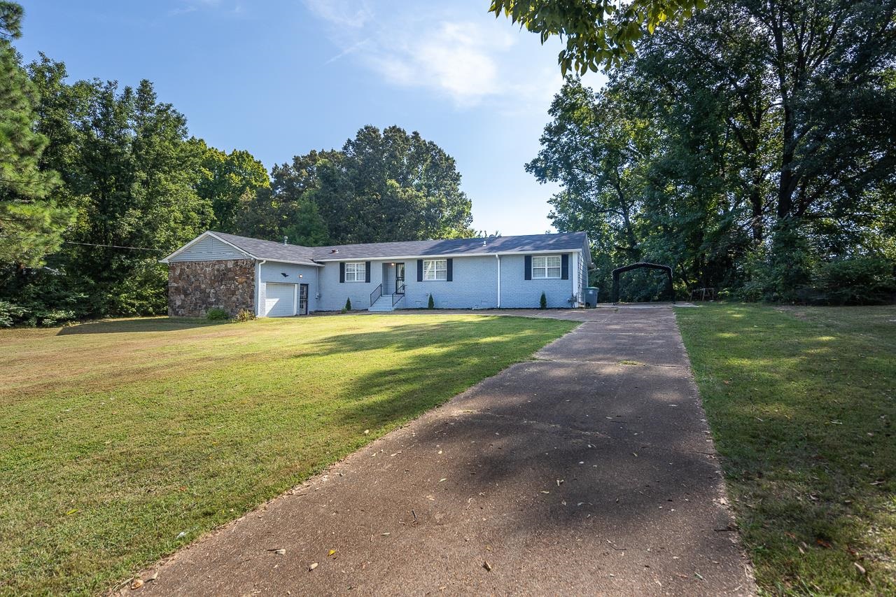 3864 Hobson Road Memphis, TN 38128 - Photo 2 of 19 View of front of house featuring a front lawn and a garage