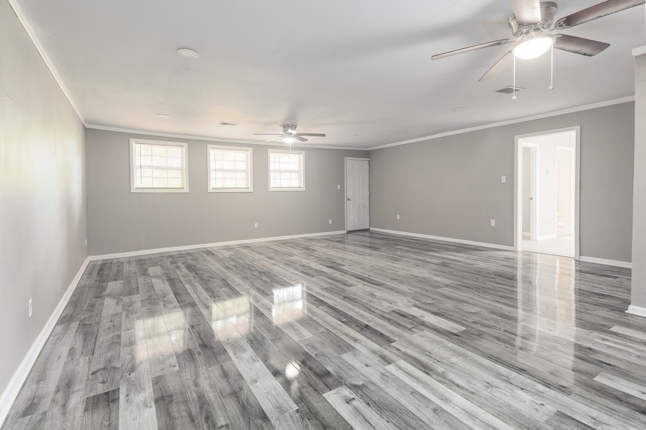 3864 Hobson Road Memphis, TN 38128 - Photo 4 of 19 Spare room featuring ceiling fan, light hardwood / wood-style floors, and crown molding