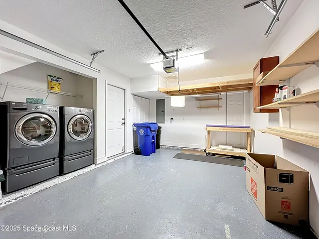 a view of a storage & utility room with washer and dryer