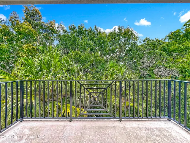 a view of a balcony with an ocean view