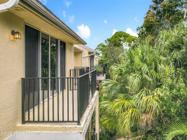 a view of a house with a tree