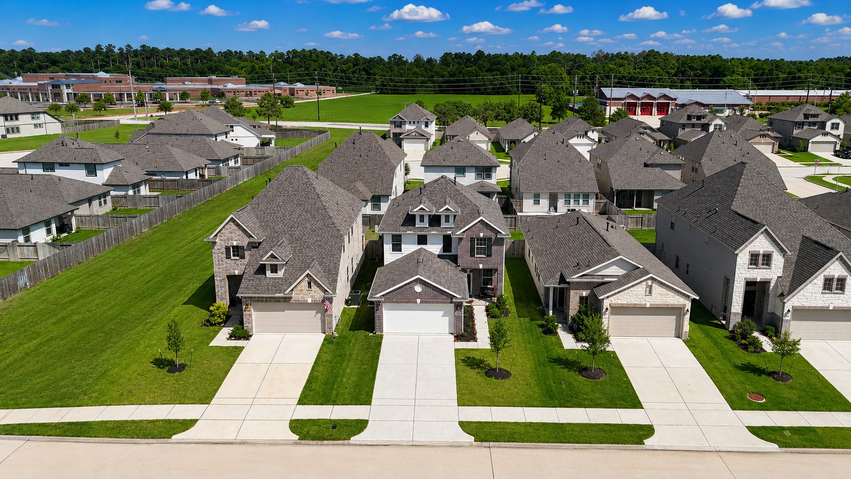 10423 Rochester Hls Lane Tomball, TX 77375 - Photo 35 of 36 Aerial front perspective highlighting the impressive footprint and welcoming entrance of your future home.