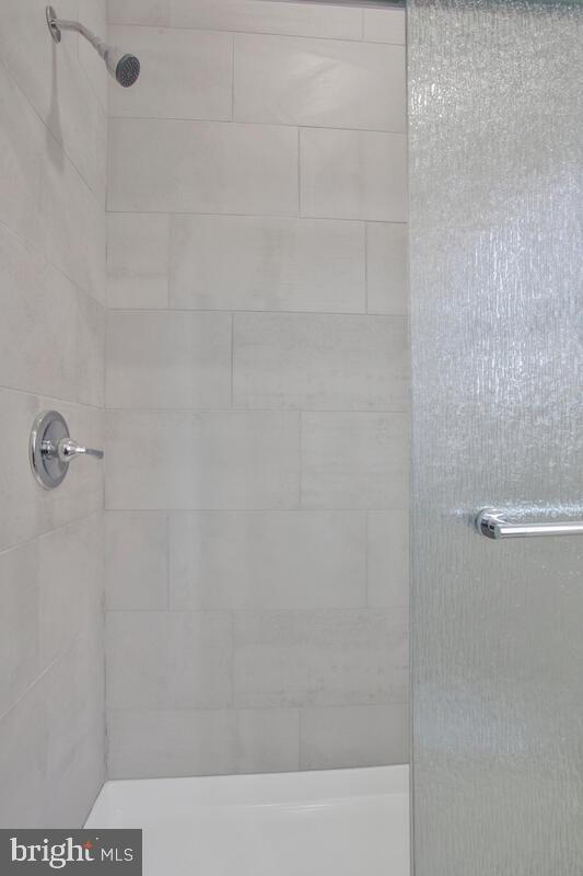 777 Powhatan Beach Road Pasadena, MD 21122 - Photo 54 of 67 glass shower doors and new tile