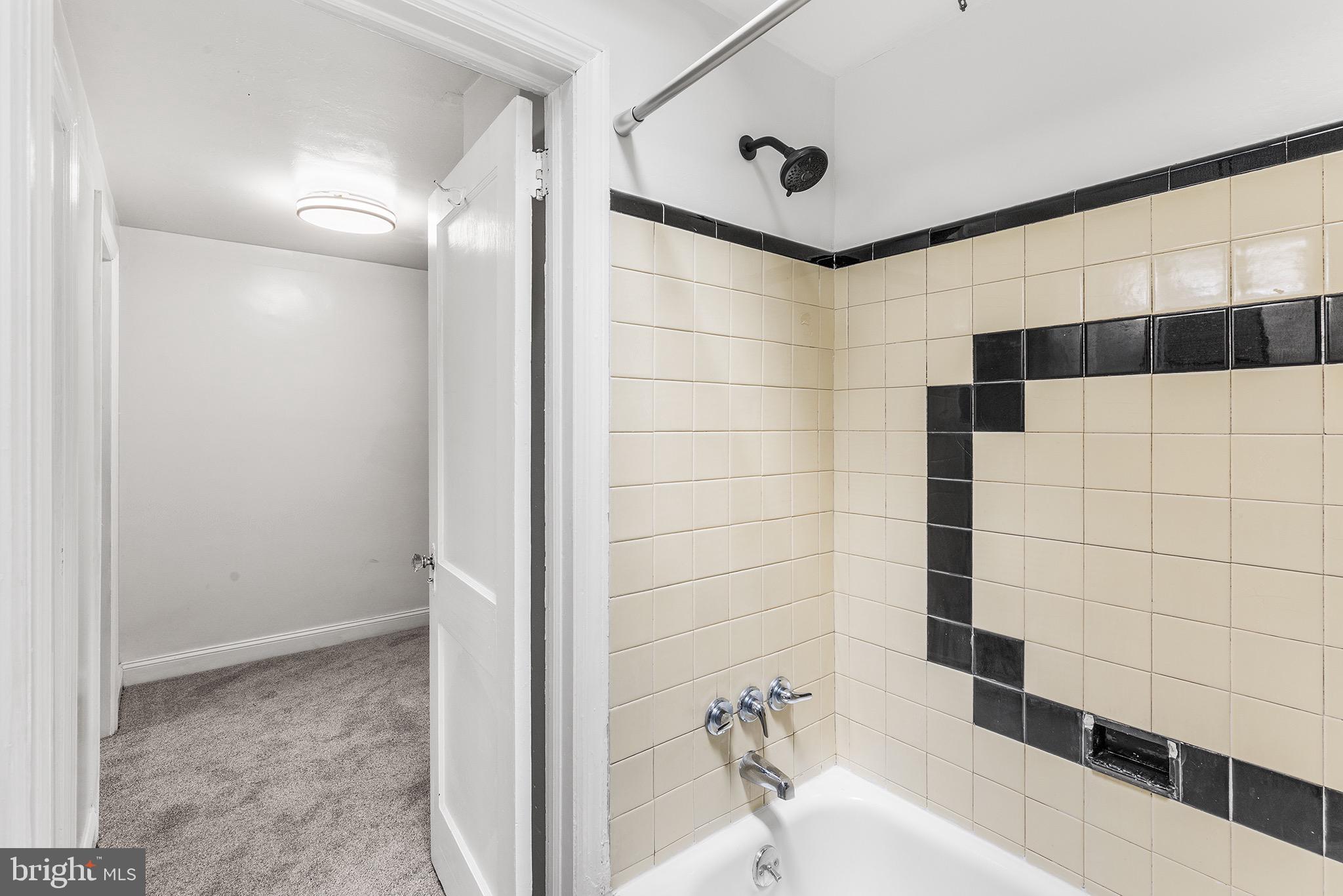 390 Glen Cove Road Collingdale, PA 19023 - Photo 21 of 27 a bathroom with a bathtub and shower
