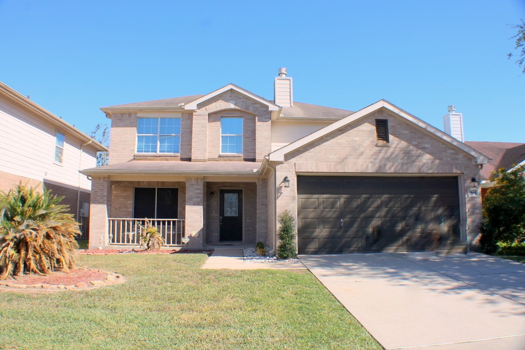 7910 Autumn Fall Street Baytown, TX 77523 - Photo 1 of 23 a front view of a house with a yard