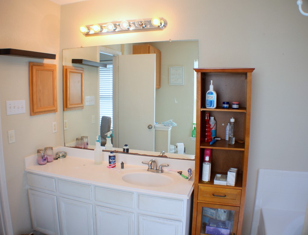 7910 Autumn Fall Street Baytown, TX 77523 - Photo 17 of 23 a bathroom with a double vanity sink and a mirror