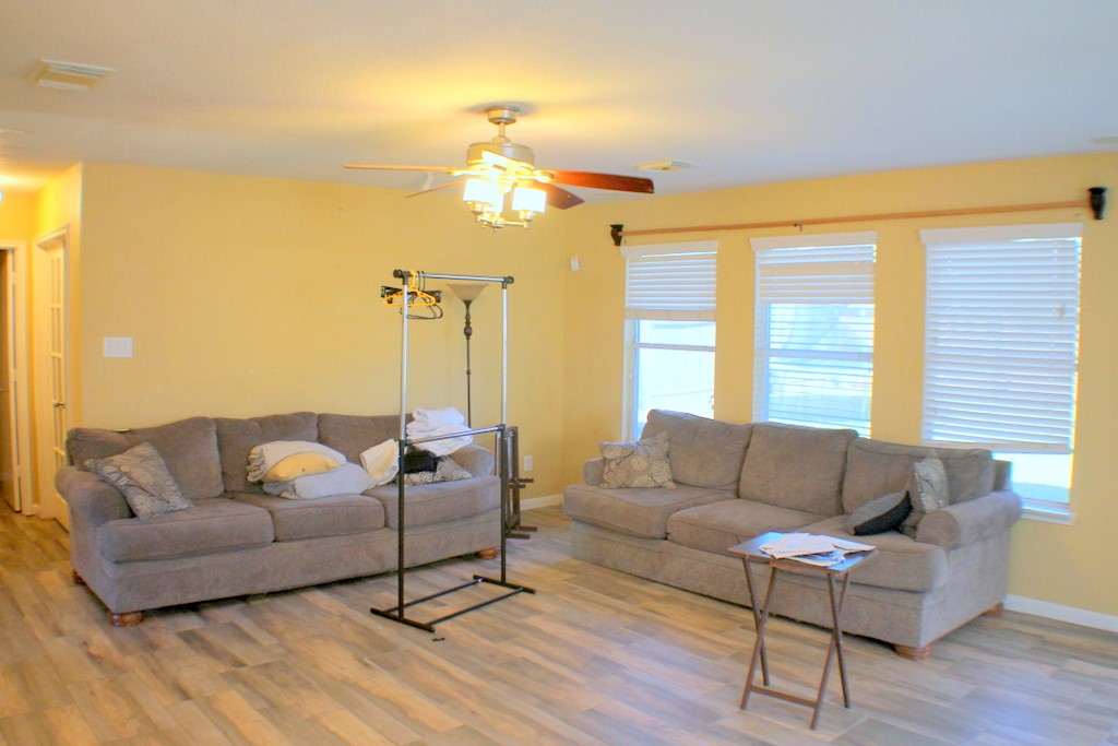 7910 Autumn Fall Street Baytown, TX 77523 - Photo 5 of 23 a living room with furniture and a large window