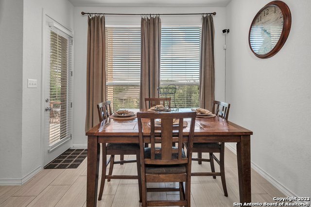 3782 Chicory Bend Bulverde, TX 78163 - Photo 14 of 41 a view of a dining room with furniture and a window