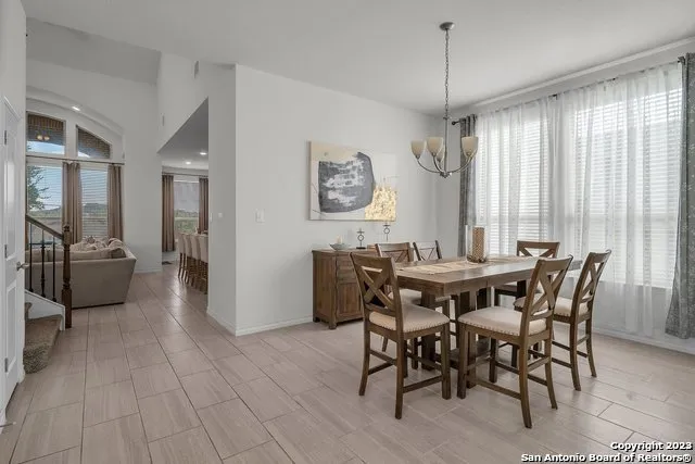 a view of a dining room with furniture window and outside view