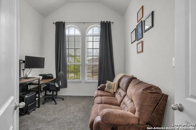 a living room with furniture and a window