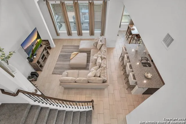a view of living room with furniture and flat screen tv