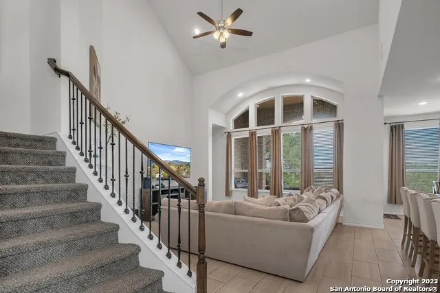 a living room with furniture and windows