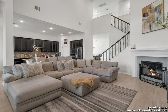 a living room with furniture and a fireplace