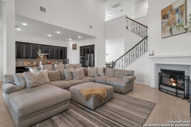 3782 Chicory Bend Bulverde, TX 78163 - Photo 9 of 41 a living room with furniture and a fireplace