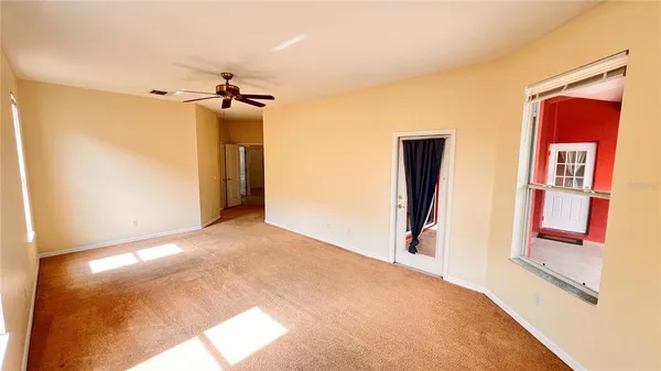 a bathroom with a toilet and a rug