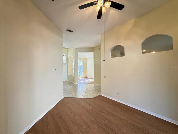 a view of hallway with wooden floor
